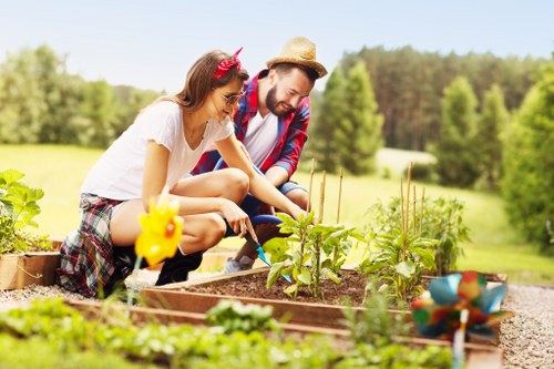 Community gardeners working in a lush urban garden in Canning Town