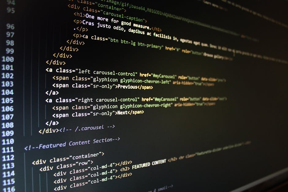 A close-up view of a computer screen displaying lines of colorful code with syntax highlighting in shades of green, purple, blue, orange, and white. The code is arranged in vertical lines with various
